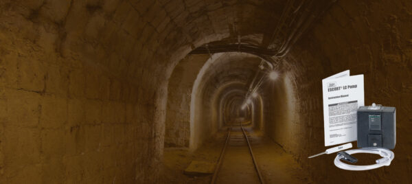 Escort ELF personal sampling pump with sampling line on an underground mine background